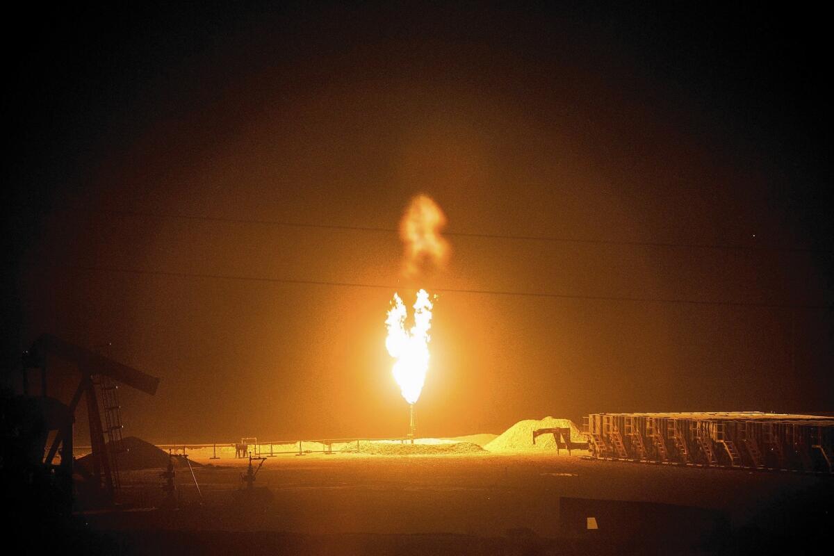 A gas flare appears outside Williston, N.D., created by the release of excess flammable gases during the drilling for oil and natural gas.