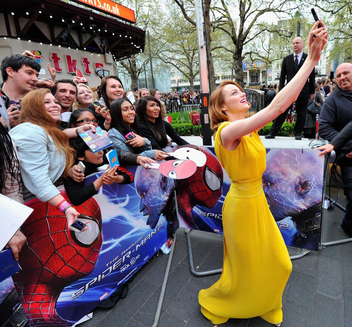 Actress Emma Stone with fans as she attends "The Amazing Spider-Man 2" world premiere at the Odeon Leicester Square in London.