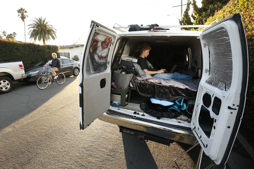 SANTA BARBARA, CA - NOVEMBER 09: UCSB student Kris Hotchkiss lives in a van borrowed from a close friend. The two friends rebuilt it to a bed, fridge, cabinets and ceiling air fan but one week into the quarter the battery short-circuited so he was without lights and electricity for six weeks. The senior communication major has to move the van to various locations near the UCSB campus. He's tried to make the best of it and says "learning to be comfortable with being uncomfortable" has helped him grow and learn resilience. California faces a statewide student housing crisis with some UCSB students forced to live in vehicles and hotels under temporary contracts due to expire next month. The crisis led the UCSB campus to move forward with a plan to build a massive 4,500-bed dorm with tiny rooms and few windows - dubbed "Dormzilla" - which sparked widespread student protests, national headlines and the resignation of the consulting architect. UC Santa Barbara on Tuesday, Nov. 9, 2021 in Santa Barbara, CA. (Al Seib / Los Angeles Times).