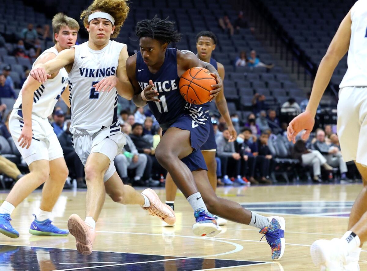 Tyler Hunt of Venice drives to the basket against Pleasant Valley.