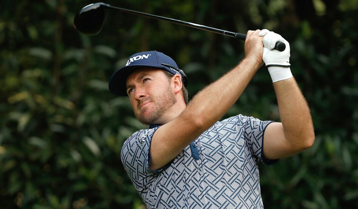 Graeme McDowell watches his tee shot at the fifth hole during the first round of the HSBC Champions tournament on Thursday in Shanghai.