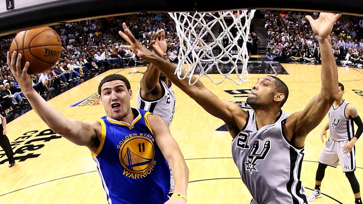 Will it be a high-flying or high-scoring affair when Klay Thompson (11) and the Warriors take on Tim Duncan (21) at the Spurs in a showdown of the NBA's two best teams?