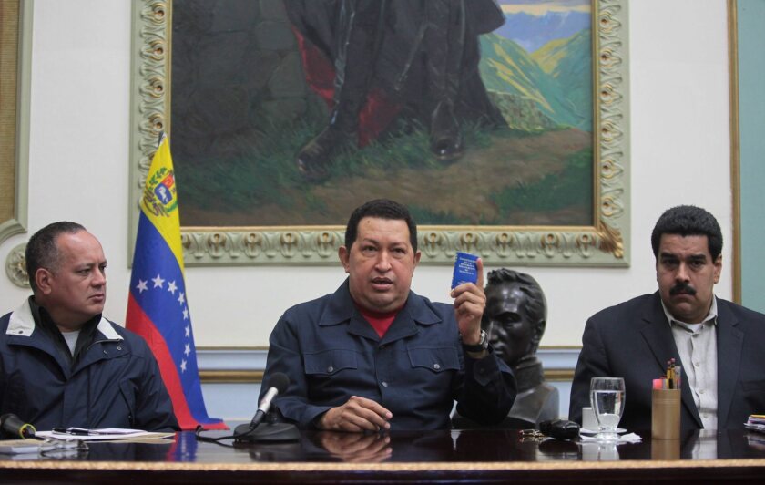 President of Venezuela, Hugo Chavez, center, said that he will return to Cuba to undergo further cancer during a national broadcast in Caracas, Venezuela. On his left is his vice president, Nicolas Maduro, and on his right was Diosdado Cabello, president of the National Assembly.