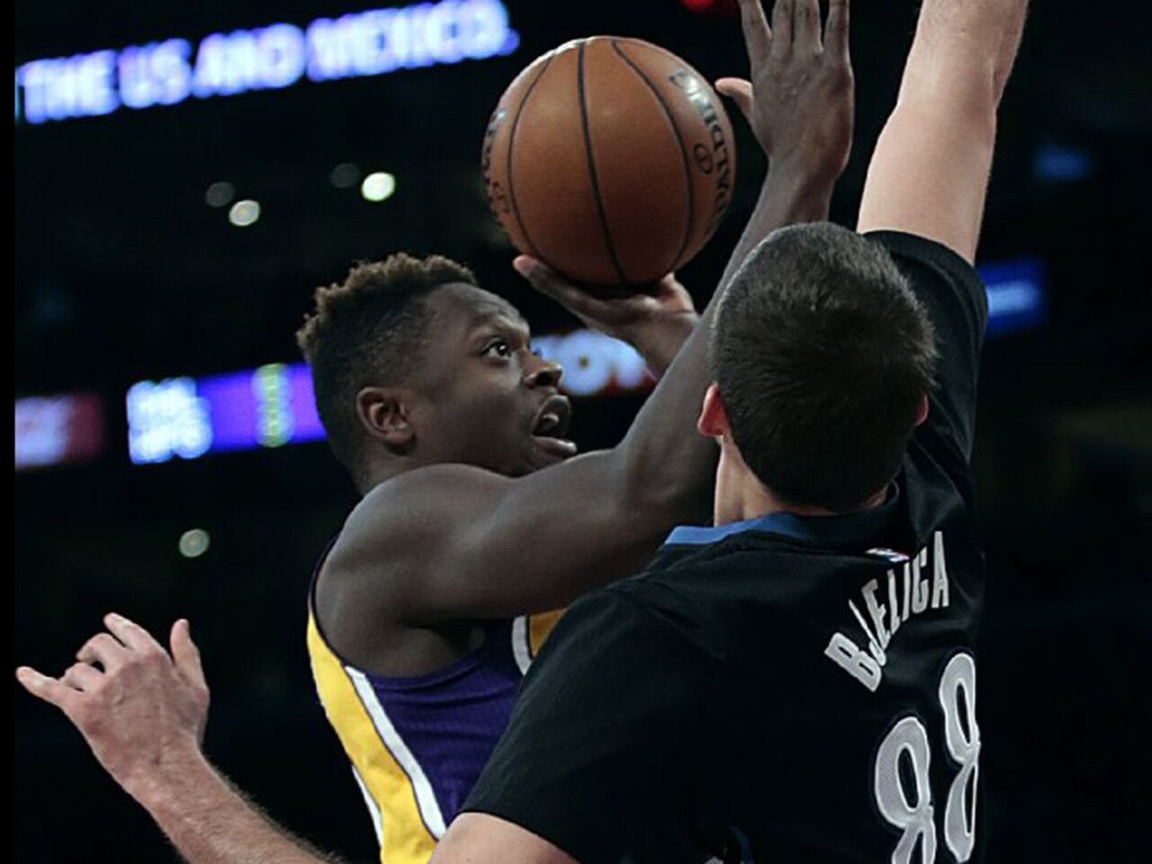Lakers forward Julius Randle tries to shoot over Timberwolves forward Nemanja Bjelica during the first half of a game at Staples Center on Feb. 2.