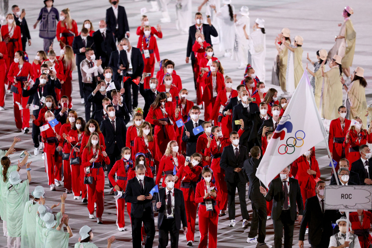 Flag bearers Sofya Velikaya and Maxim Mikhaylov of ROC lead the team into Olympic Stadium.