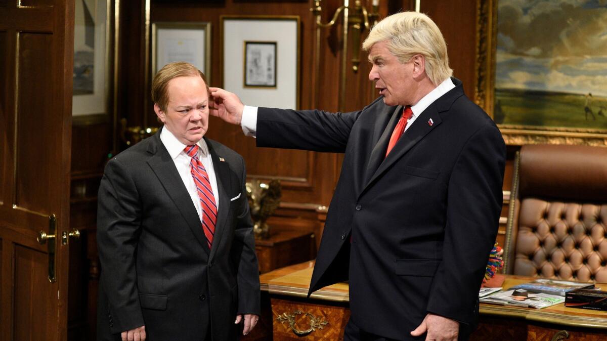 Melissa McCarthy as former Press Secretary Sean Spicer and Alec Baldwin as President Trump.