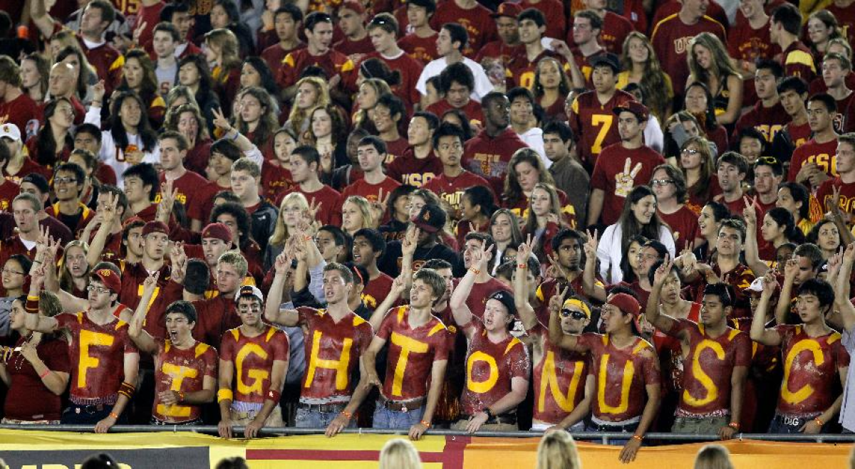 Fans cheer in the student section of the Coliseum during a game between USC and Virginia on Sept. 11, 2010.
