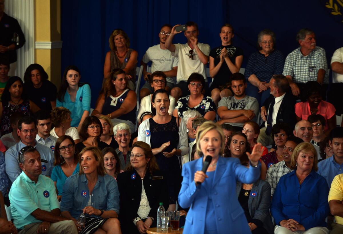 Hillary Rodham Clinton spoke about the economy, the nuclear deal with Iran and other issues in Dover, N.H., on Thursday at the first town hall of her 2016 presidential campaign. She was briefly interrupted by a protester.