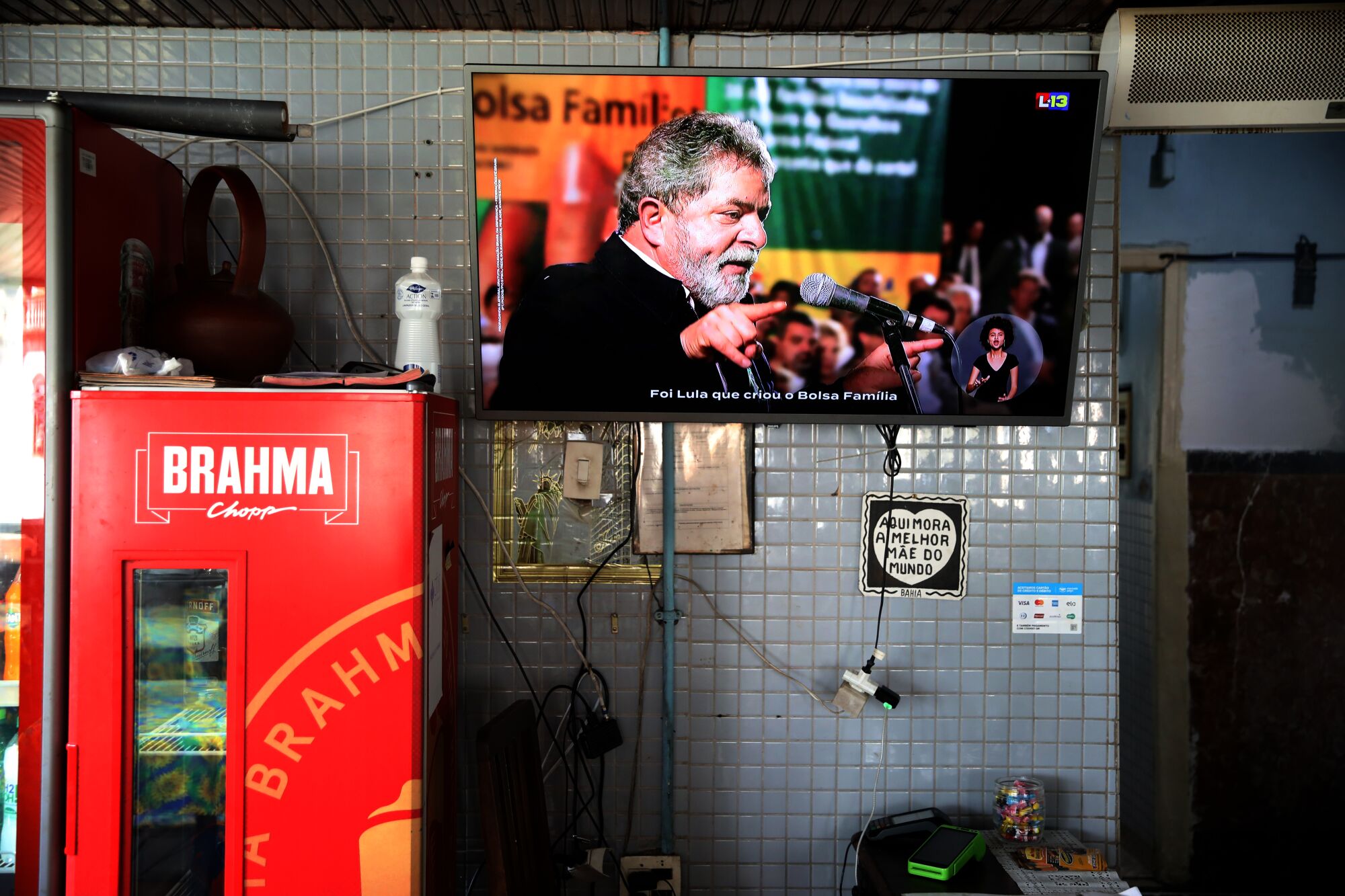 A man talks on a TV.