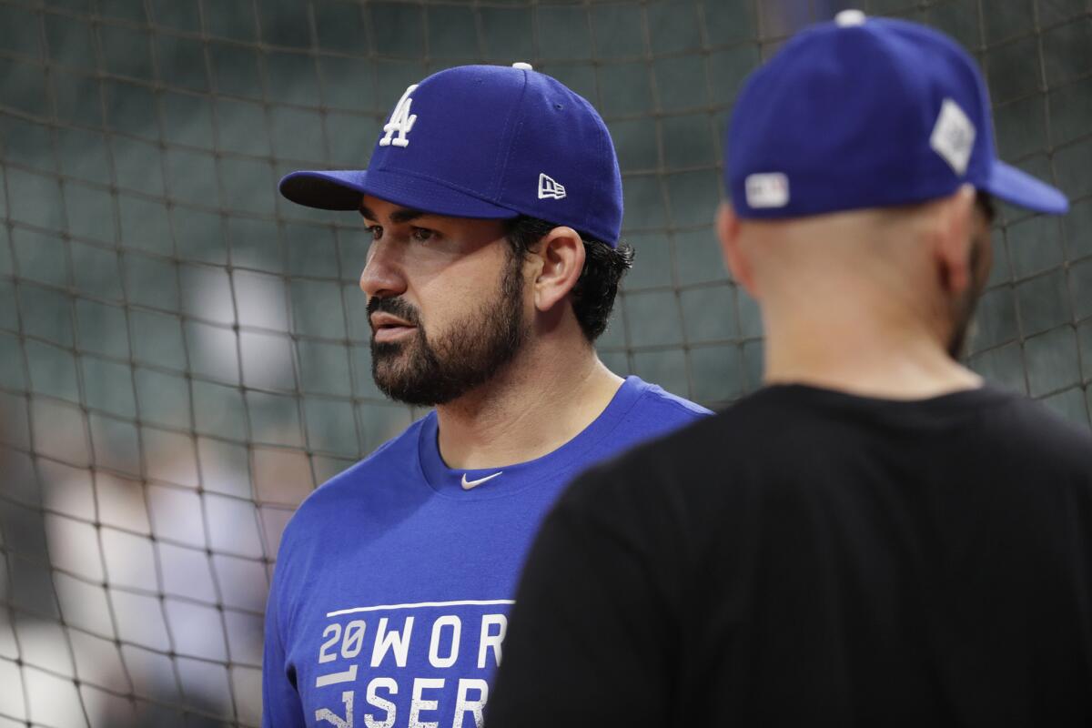 Adrian Gonzalez joined his Dodgers teammates before Game 3 of the World Series, but spent most of it apart from the team.
