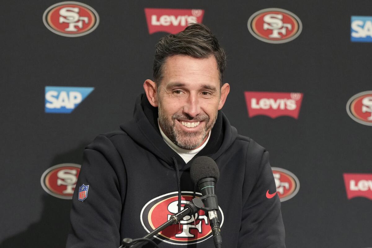 San Francisco 49ers head coach Kyle Shanahan smiles while speaking at a news conference.