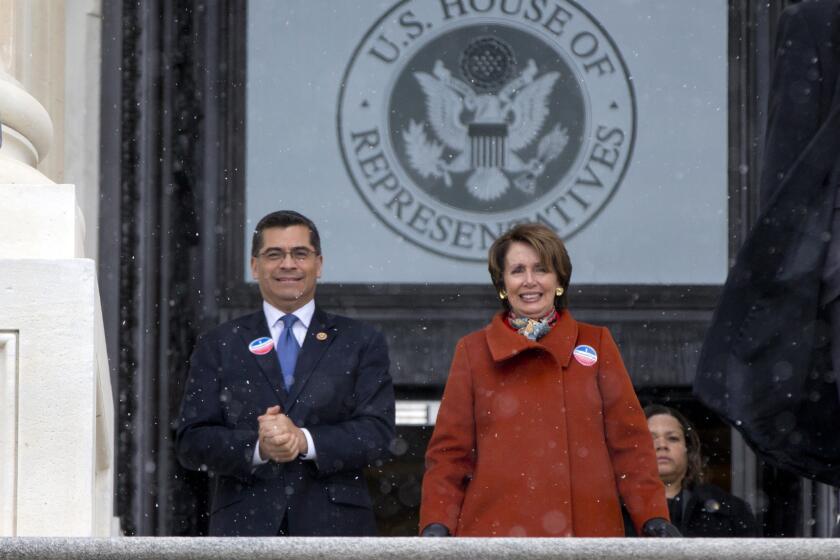 Rep. Xavier Becerra (D-Los Angeles) and House Minority Leader Nancy Pelosi of San Francisco walk with other House Democrats and immigration leaders to gather on the steps of the Capitol. Democrats sought to force a vote on immigration reform.
