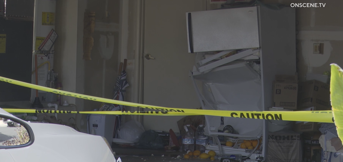 A 91-year-old driver backed into his neighbor's home and then slammed into his own garage.