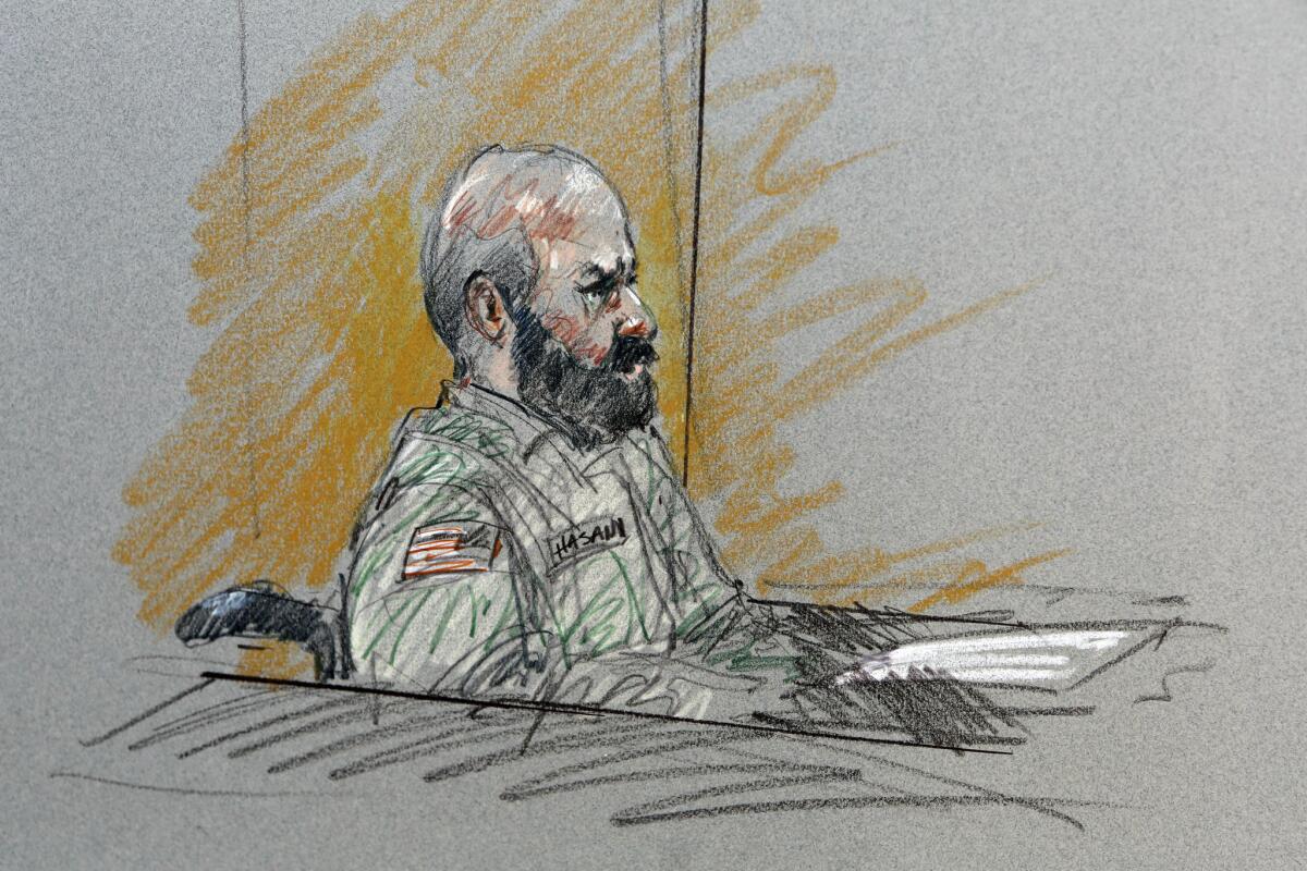 In this courtroom sketch, Maj. Nidal Malik Hasan sits in court for his court-martial Tuesday at Ft. Hood.