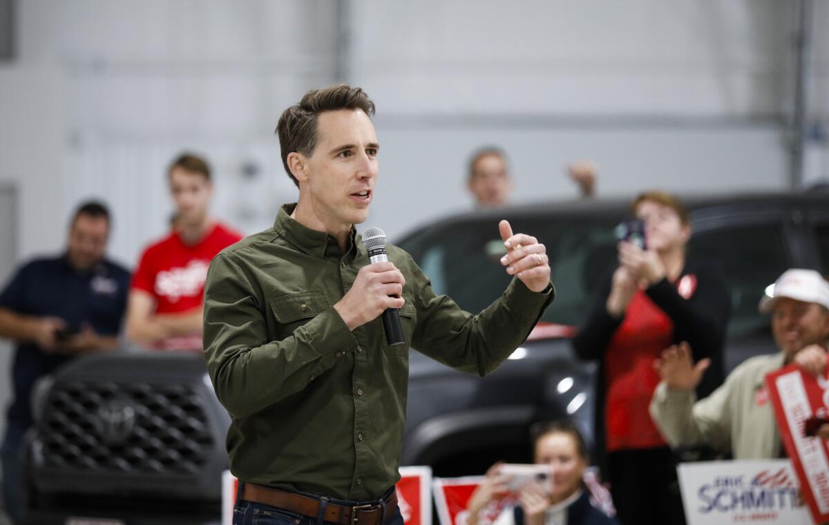 Sen. Josh Hawley campaigns with U.S. Senate Candidate Eric Schmitt in Springfield, Mo., on Monday, Nov. 7, 2022. (Nathan Papes/The Springfield News-Leader via AP)