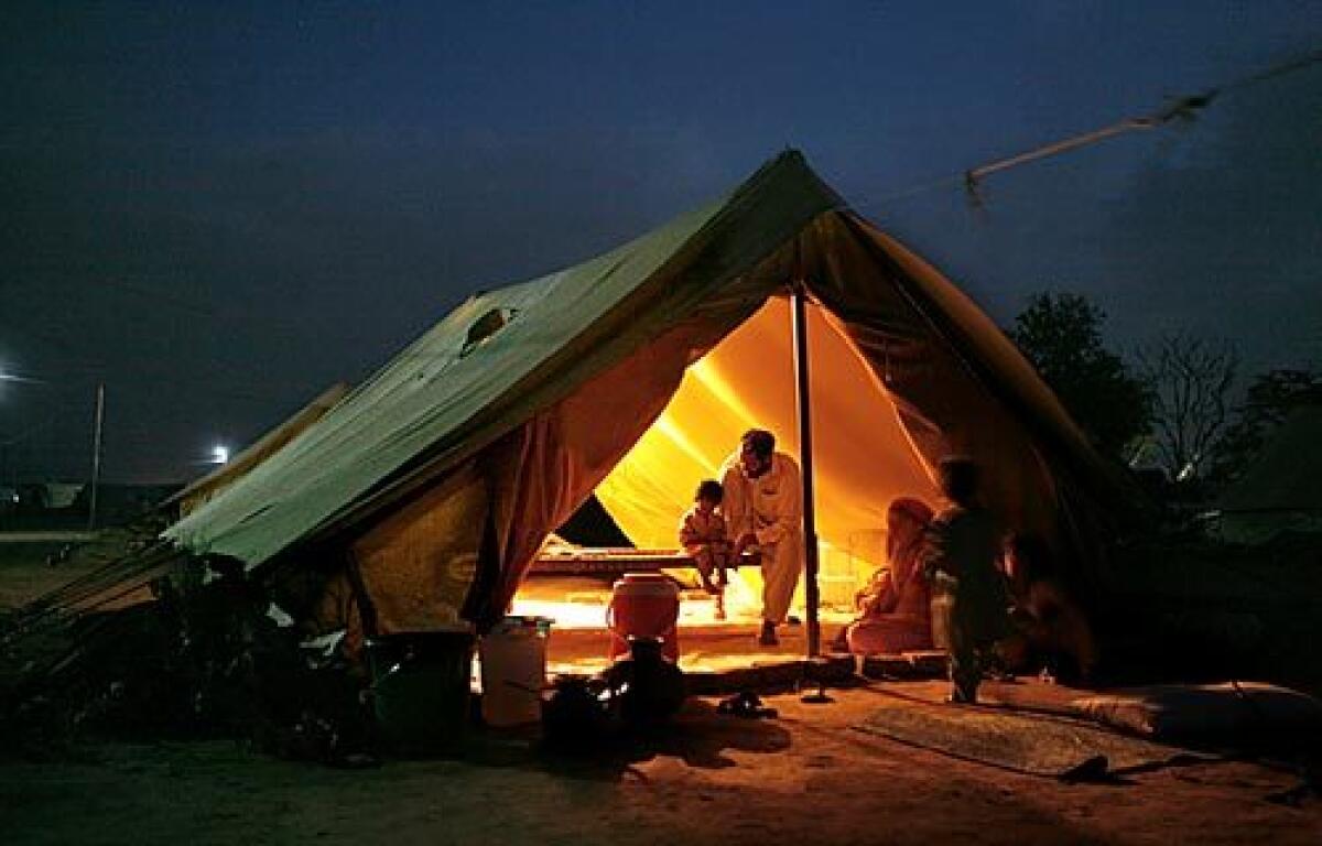 More than 25,000 Pakistanis are sheltering at the Chota Lahore  "Little Lahore"  camp outside Swabi, in North-West Frontier Province. They fled the Swat Valley and adjoining districts amid the military campaign against Taliban militants. Camp residents queue for hours for food, many sleep on the hard ground, and very few of the tents have electricity.