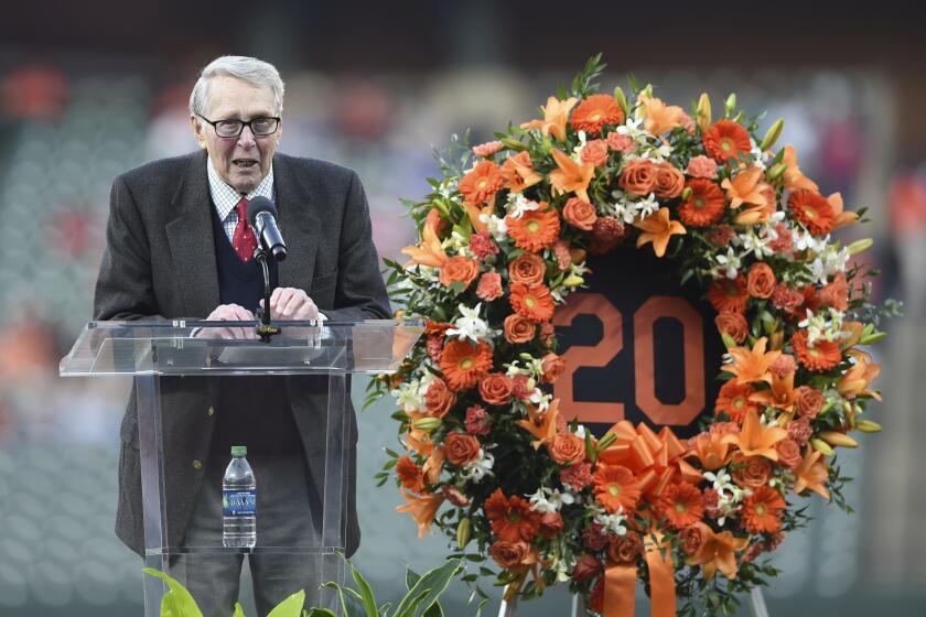 FILE - Former Baltimore Oriole Brooks Robinson speaks during a ceremony in memory of Frank Robinson before a baseball game between the Orioles and the New York Yankees, Saturday, April 6, 2019, in Baltimore. Robinson, whose deft glovework and folksy manner made him one of the most beloved and accomplished athletes in Baltimore history, has died, according to a joint announcement by the Orioles and his family Tuesday, Sept. 26, 2023. (AP Photo/Gail Burton, File)