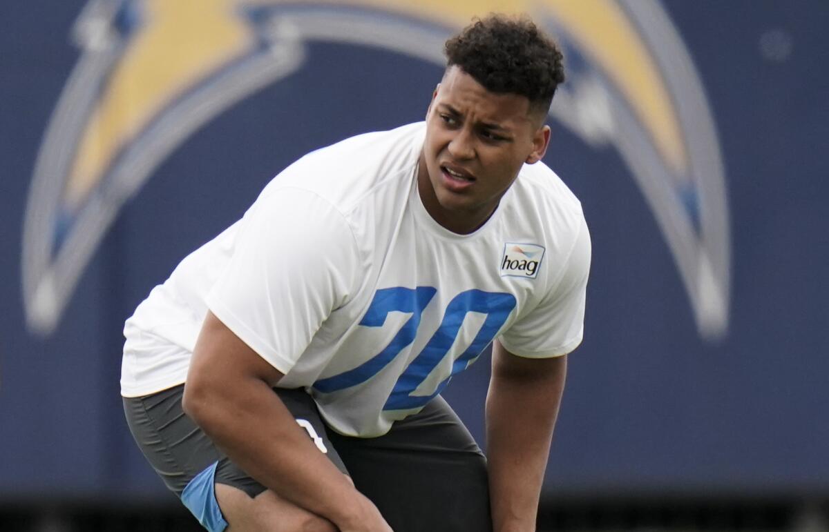 Chargers offensive tackle Rashawn Slater participates in a drill at practice.