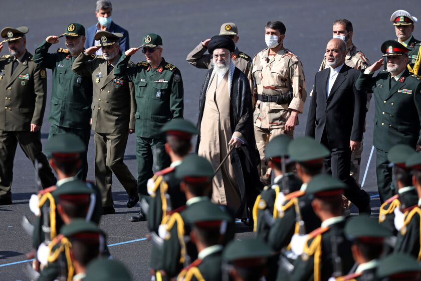 In this picture released by the official website of the office of the Iranian supreme leader, Supreme Leader Ayatollah Ali Khamenei, center, reviews a group of armed forces cadets during their graduation ceremony accompanied by commanders of the armed forces, at the police academy in Tehran, Iran, Monday, Oct. 3, 2022. Khamenei responded publicly on Monday to the biggest protests in Iran in years, breaking weeks of silence to condemn what he called “rioting” and accuse the U.S. and Israel of planning the protests. (Office of the Iranian Supreme Leader via AP)