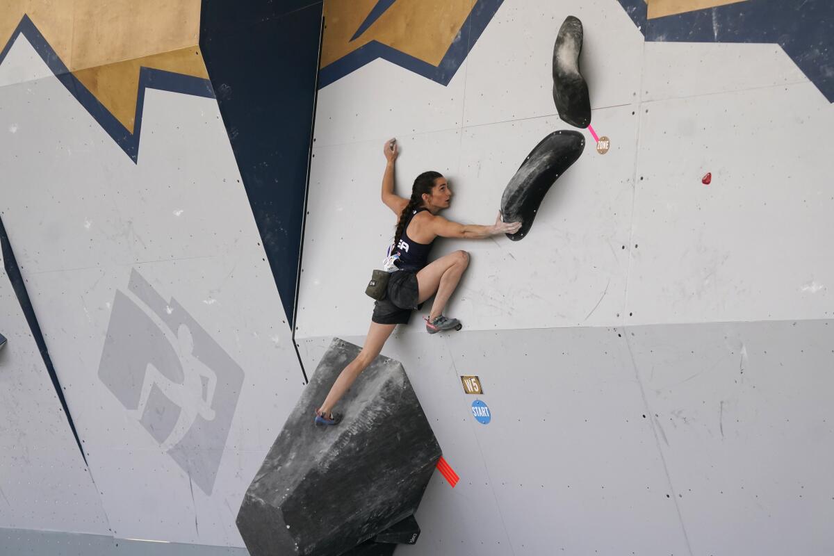 The United States' Kyra Condie climbs during women's boulder qualifications