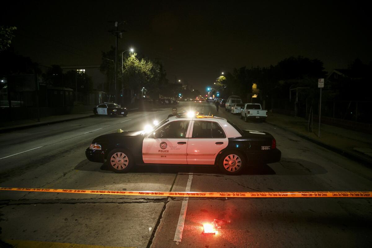 Los Angeles police swarm Boyle Heights earlier this month, after an exchange of gunfire that left a 28-year-old man dead and a police officer wounded.