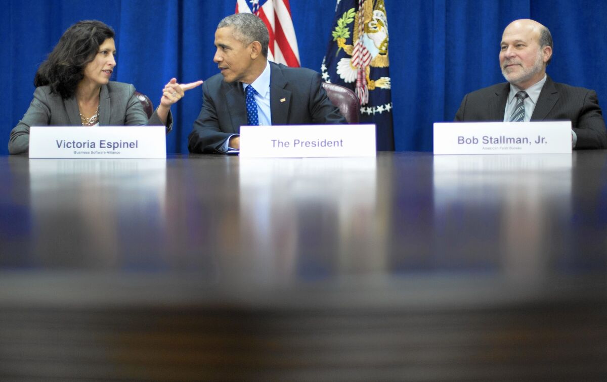 President Obama, with Software Alliance Chief Executive Victoria Espinel and American Farm Bureau President Bob Stallman Jr., appears at the Department of Agriculture to promote the Pacific Rim trade agreement.