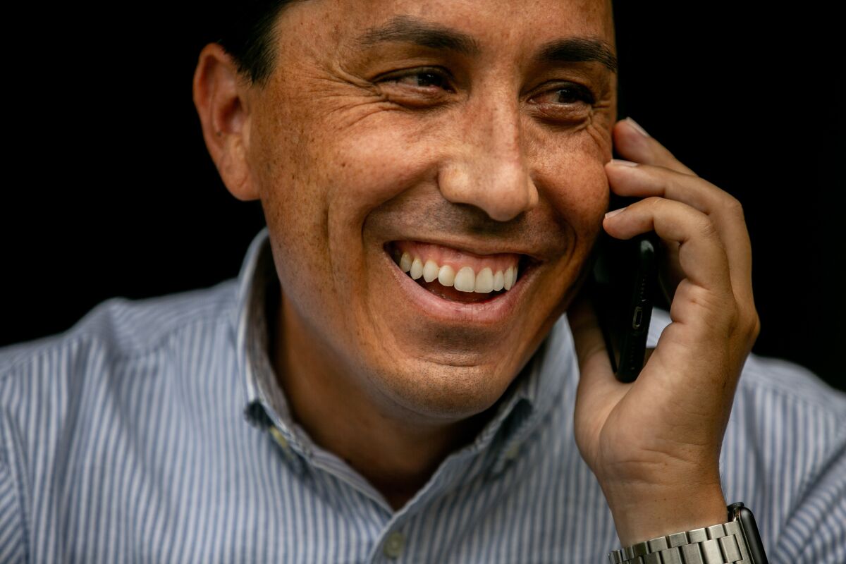 Todd Gloria, who is on track to be mayor-elect of San Diego, takes a phone call at his home last week.