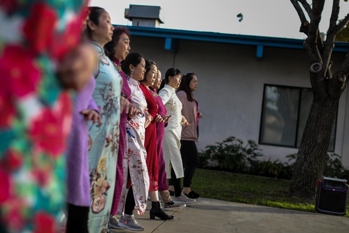 A group of women practices for a dance competition at Barnes Park, seen during a tour of Monterey Park.