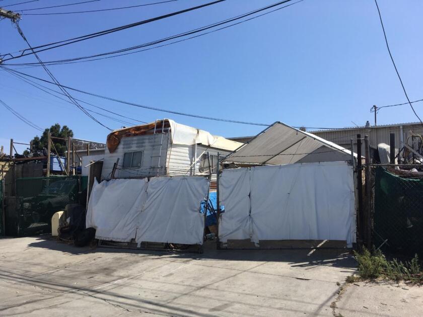 Neighbors say Rodolfo Montoya, 37, lived in this motor home in an alley along Jacquelyn Lane in Huntington Beach. Montoya has pleaded not guilty to charges he threatened to carry out a mass shooting at the Long Beach Marriott hotel where he worked.