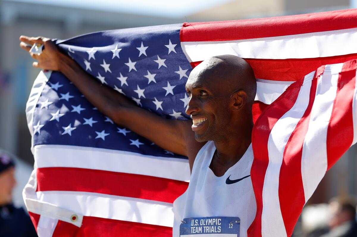 Abdi Abdirahman celebrates after finishing third during the men's U.S. Olympic marathon team trials in Atlanta in February.