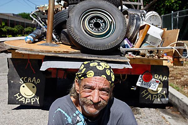 Mike Sroufe, owner of Scrap Happy, picks up curbside scrap in a North Hollywood neighborhood. Some in the area have complained that scrap haulers are turning the area into a dump. Sroufe says he helps keep the streets free of junk, which he sells at a recycling yard. See full story