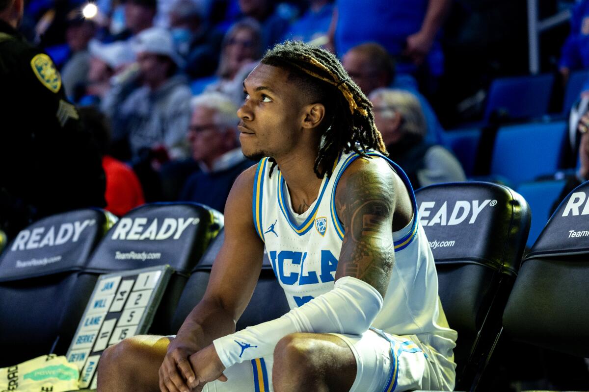 UCLA guard Dylan Andrews sits on the bench during player introductions before a win over Oregon State on Thursday.