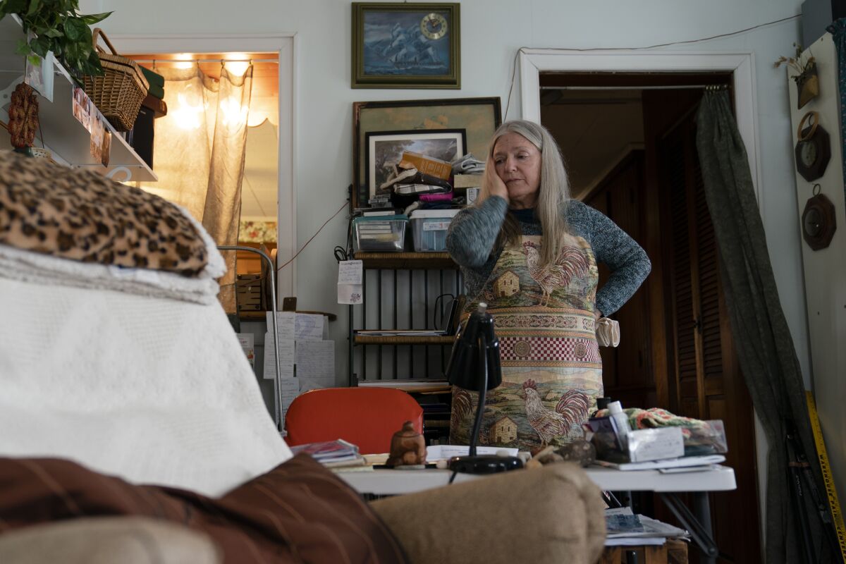 A woman pausing and looking at a desk