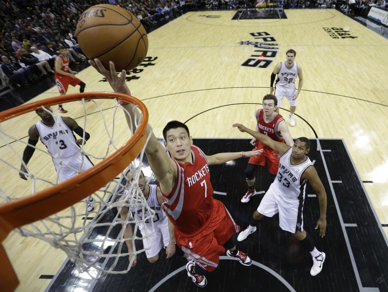 Jeremy Lin scores a basket for the Houston Rockets