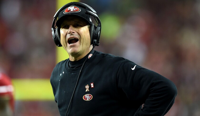 San Francisco 49ers Coach Jim Harbaugh argues a call during a 19-3 loss to the Seattle Seahawks.