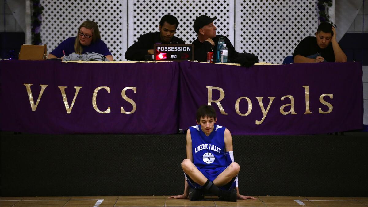 Roberto Garta waits to enter the game for Lucerne Valley.