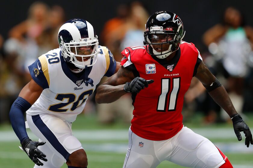 ATLANTA, GEORGIA - OCTOBER 20: Jalen Ramsey #20 of the Los Angeles Rams defends against Julio Jones #11 of the Atlanta Falcons in the first half at Mercedes-Benz Stadium on October 20, 2019 in Atlanta, Georgia. (Photo by Kevin C. Cox/Getty Images)