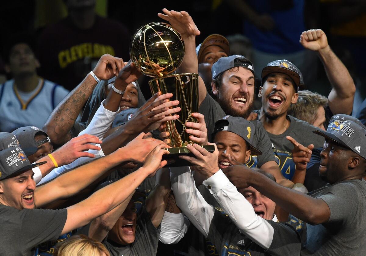 The Golden State Warriors celebrate winning the 2015 NBA title.