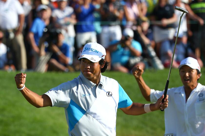 Hideki Matsuyama reacts along with his caddie after sinking the winning putt on the first playoff hole at the Memorial on Sunday.