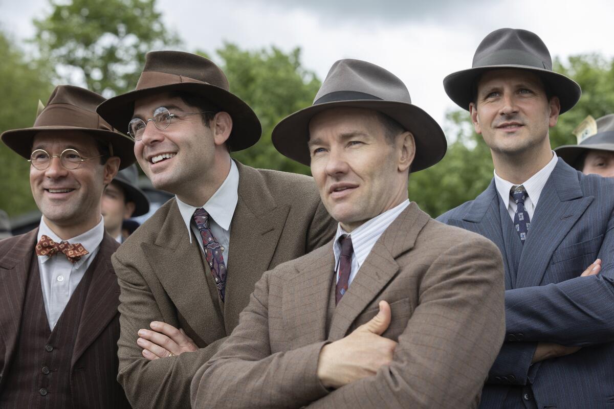 Chris Diamantopoulos, from left, James Wolk and Joel Edgerton in a scene from "The Boys in the Boat."