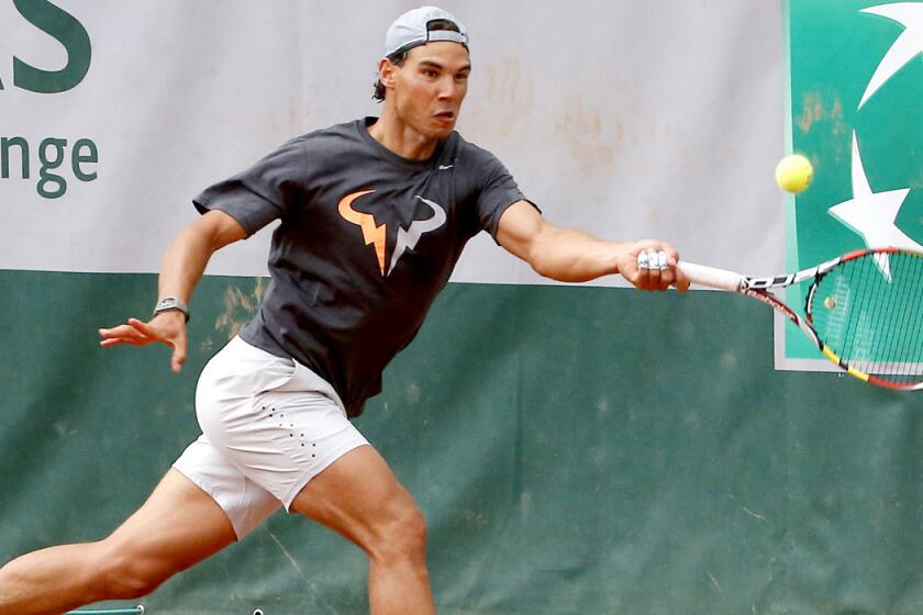 Rafael Nadal tracks down a shot during a training session for the French Open.