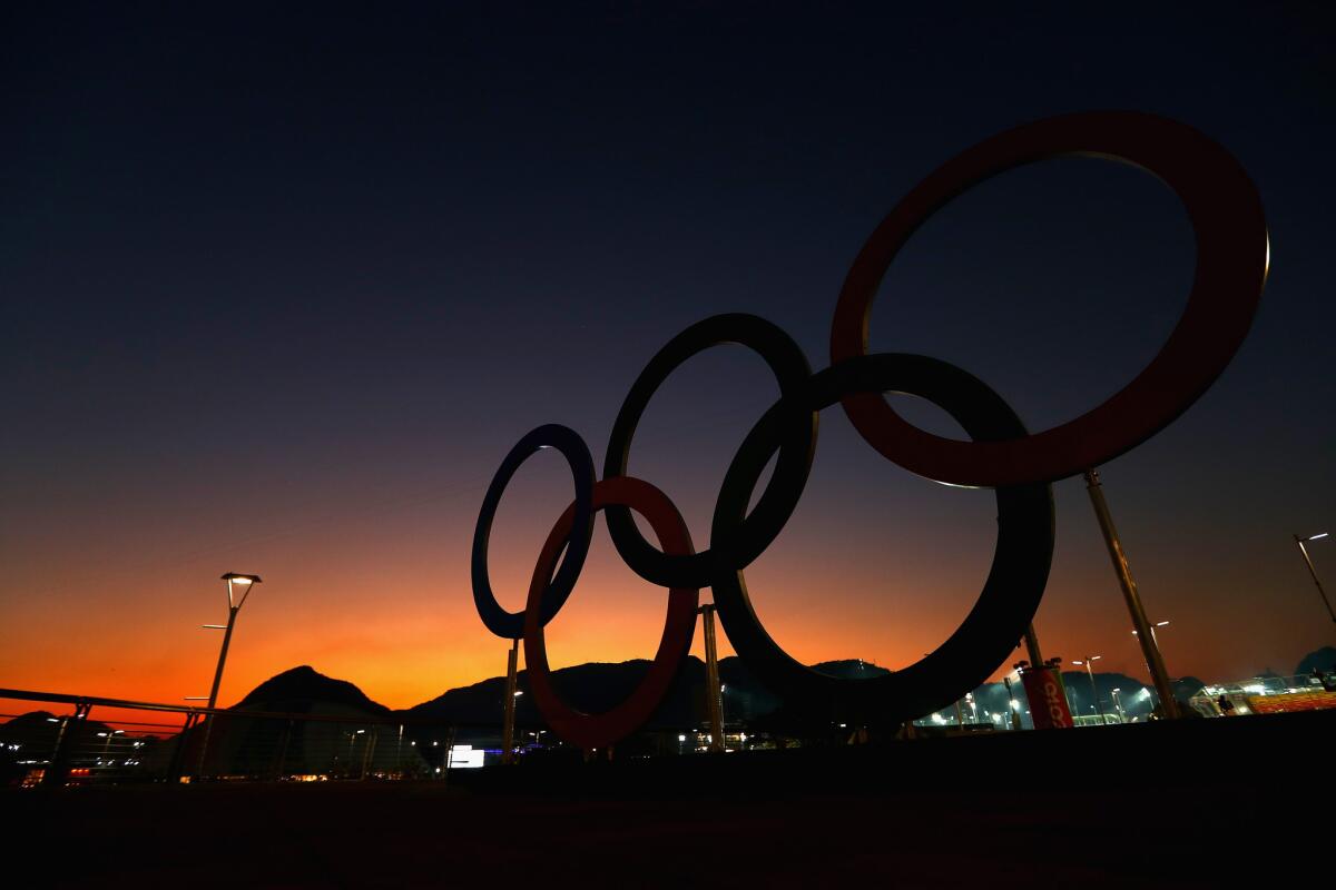 The sun sets over the Olympic Rings on the Olympic Park on Aug. 1.