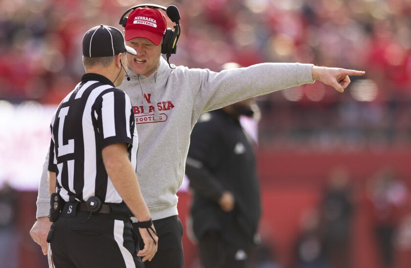 Nebraska head coach Scott Frost argues for officials to review and overturn a touchdown reception called for Iowa during the first half of an NCAA college football game Friday, Nov. 26, 2021, at Memorial Stadium in Lincoln, Neb. Following review, the call was reversed and the pass was declared incomplete. (AP Photo/Rebecca S. Gratz)