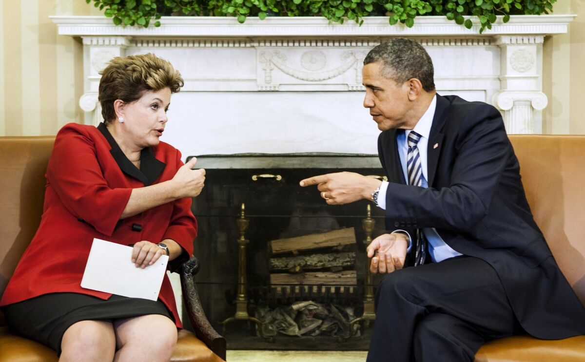 President Obama listens to Brazilian President Dilma Rousseff during a meeting in the Oval Office. Revelations of U.S. spying on Rousseff may complicate the next meeting between the two leaders.