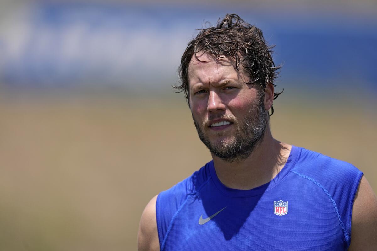 The hair of Rams quarterback Matthew Stafford is covered with sweat after a practice.