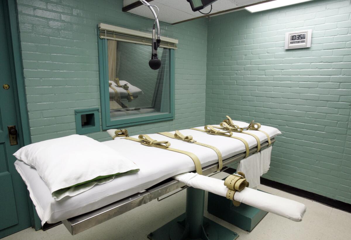A microphone hangs over the bed in the Huntsville, Texas, death chamber in 2008. Convicted killer Willie Trottie was put to death by lethal injection in Huntsville.