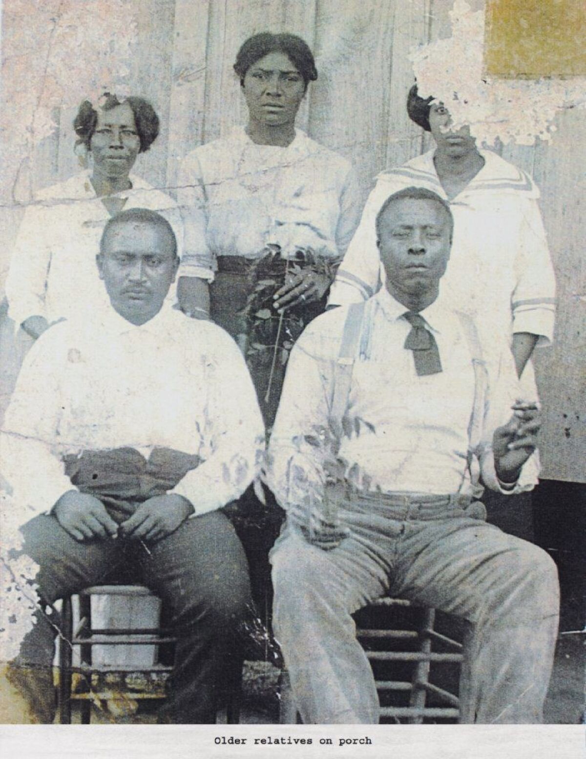 A page from Earnestine Smith's journal showing older relatives in a family portrait on the porch.