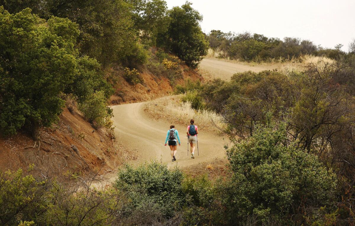 Hikers traverse the Backbone Trail before the Woolsey fire closed it. On Thursday, the last six miles of the trail reopened.