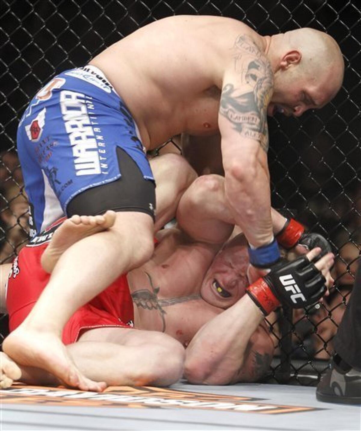 UFC 116: Brock Lesnar overcomes savage beating to stop Carwin in 2nd round