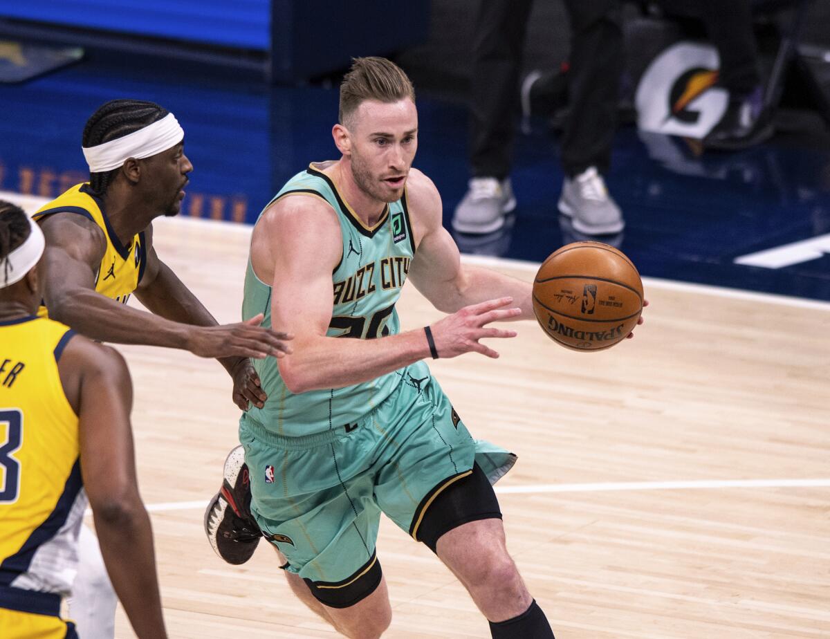 Charlotte Hornets forward Gordon Hayward (20) drives to the basket during the first half of the team's NBA basketball game against the Indiana Pacers in Indianapolis, Friday, April 2, 2021. (AP Photo/Doug McSchooler)